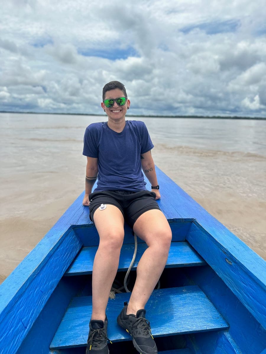 The author smiling on a boat on the Amazon River